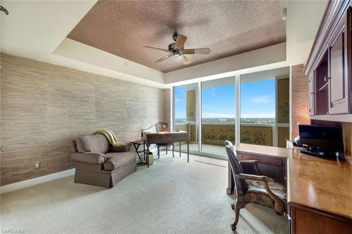 VIP Bedroom Suite with Tray Ceiling and Sliding Glass Doors to Balcony (Used as Home Office Currently)