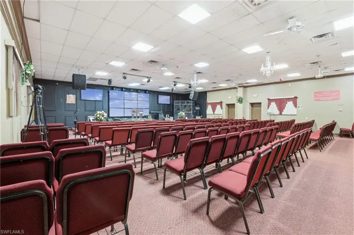 Miscellaneous room with ceiling fan and a drop ceiling