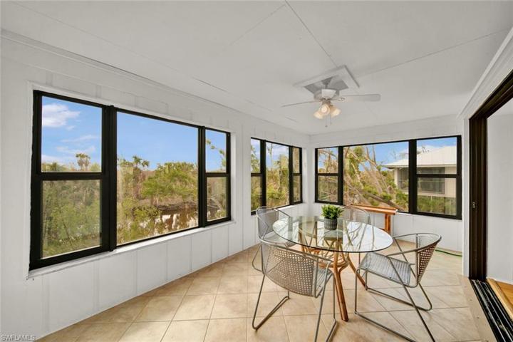 Sunroom with water and preserve views
