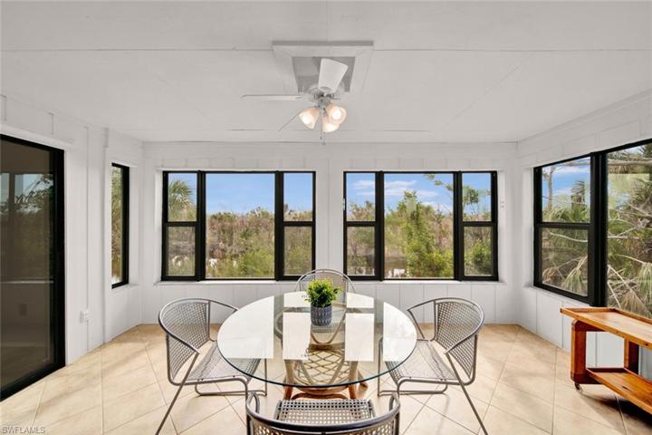 Sunroom with water and preserve views