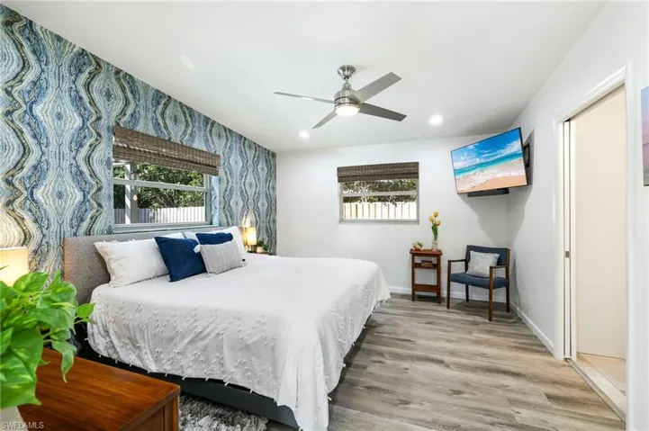 Bedroom featuring hardwood / wood-style floors and ceiling fan