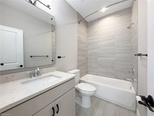 Bathroom featuring vanity and bathtub / shower combination