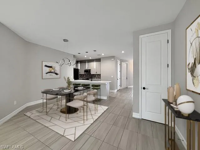 Dining room with baseboards and recessed lighting