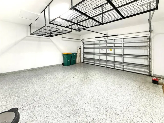 Garage featuring baseboards