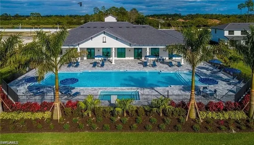 Community pool with a patio area