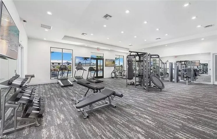 Exercise room featuring recessed lighting