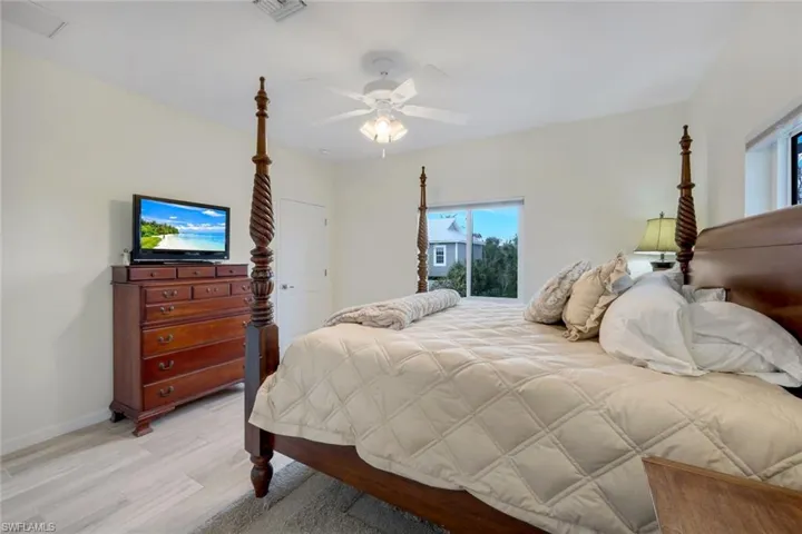 Bedroom featuring light wood-style flooring and ceiling fan