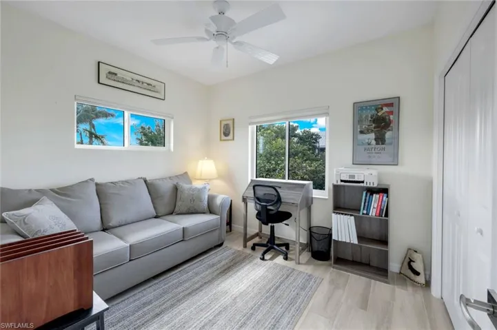 Office space featuring light wood finished floors and a ceiling fan