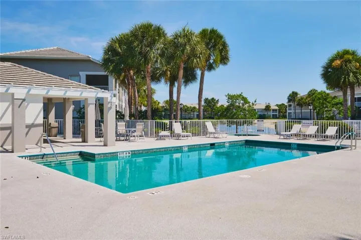 Community pool with a patio area.