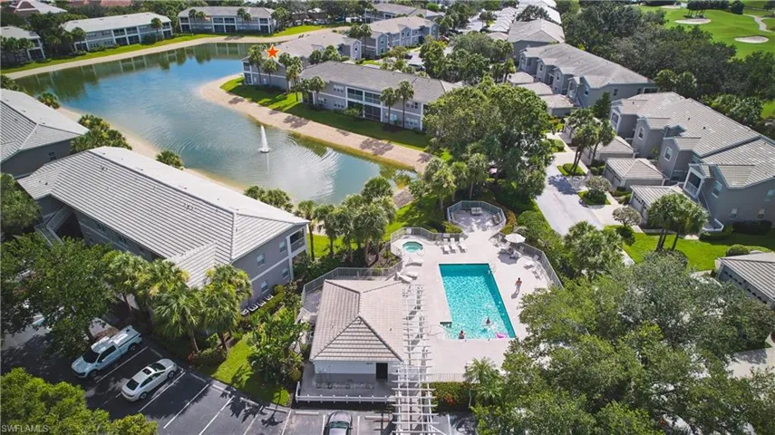 Aerial perspective of the condo complex and community pool.