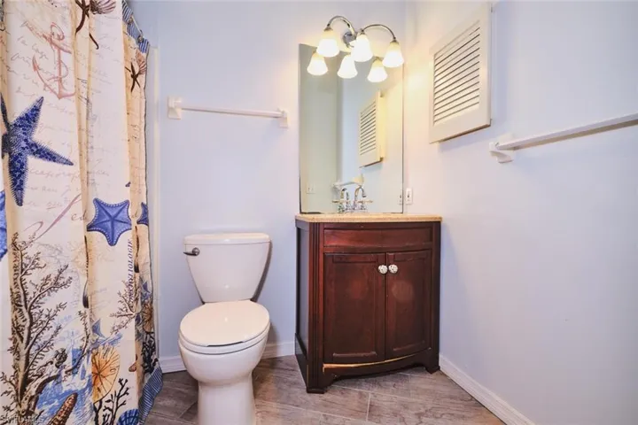 Guest bath with tub and shower combo.
