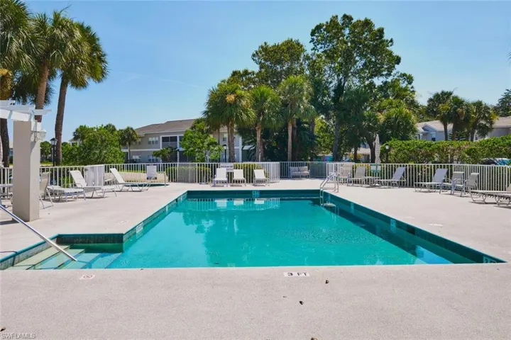 Community pool with a patio area.