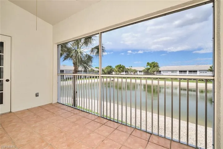Screened lanai with tile floors and ceiling fan.