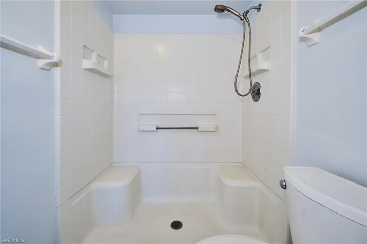 Full bathroom featuring separate shower room.