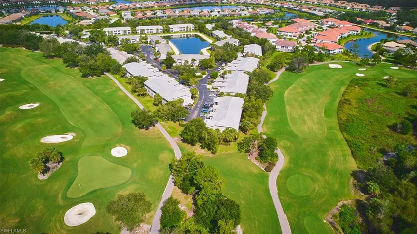 Aerial perspective of the community area featuring residential lakes and a golf course