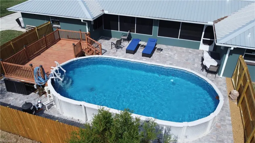 View of pool featuring a deck