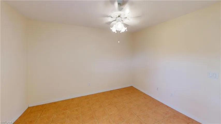 Spare room with ceiling fan