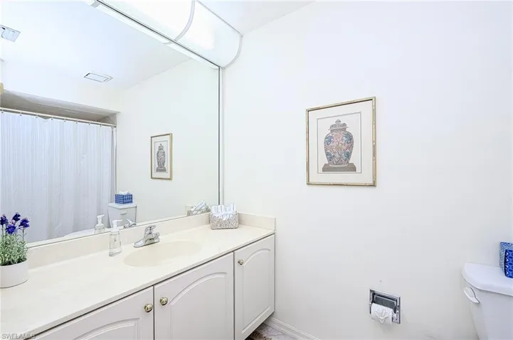 Full bath featuring toilet and vanity