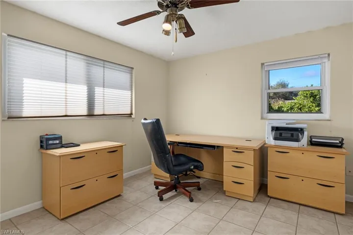Tiled home office with ceiling fan