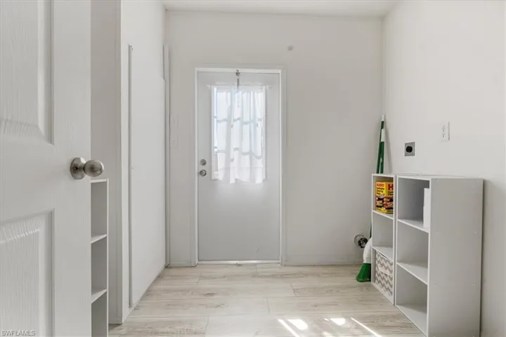 Doorway featuring light wood-type flooring