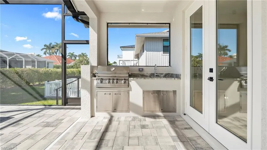 Unfurnished sunroom with french doors