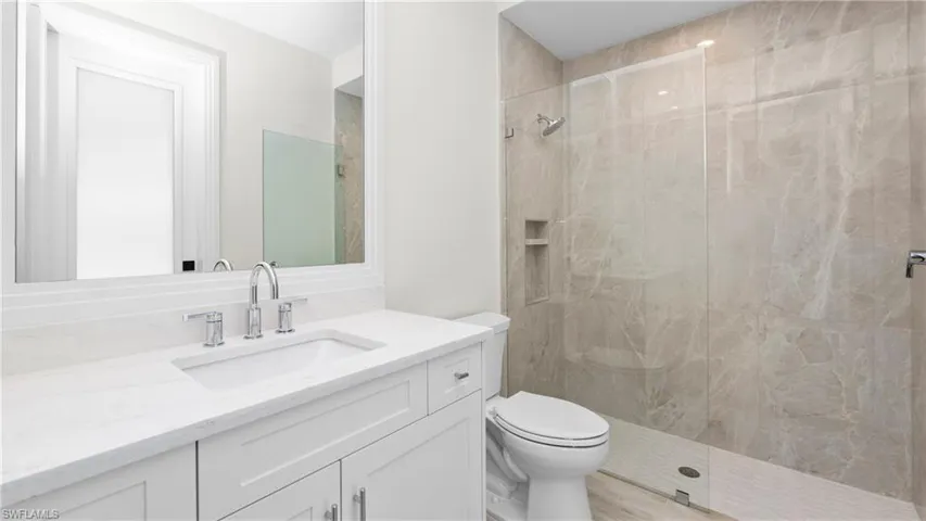 Full bathroom featuring vanity and a walk in shower