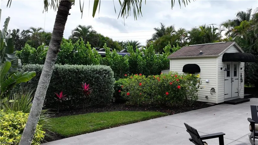 View of patio with an outbuilding