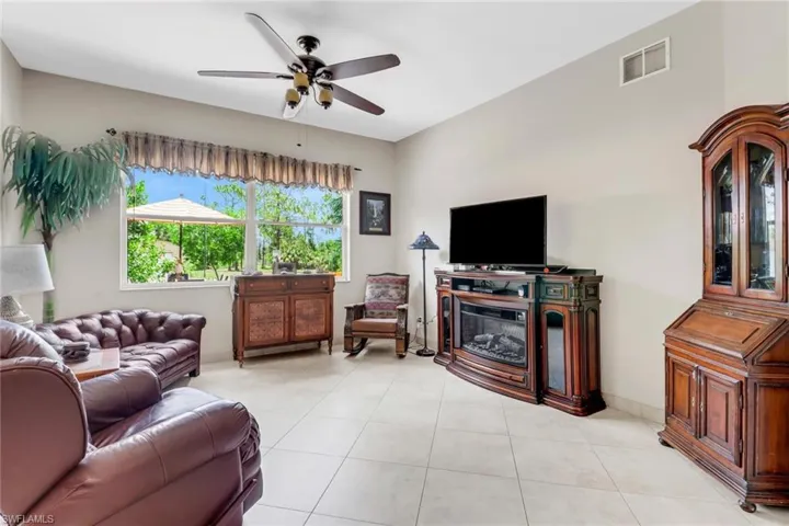 Tiled living room with ceiling fan