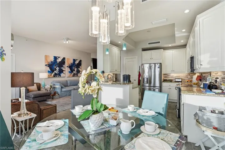 Dining space featuring recessed lighting and a raised ceiling - Virtually Edited Image