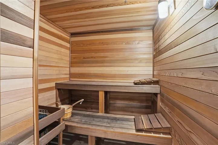 Sauna / steam room featuring wooden ceiling and wood walls - Virtually Edited Image