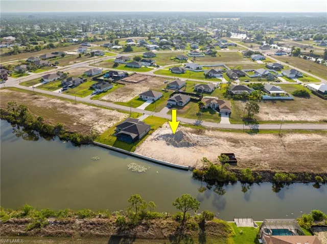 Aerial view of residential area with a nearby body of water
