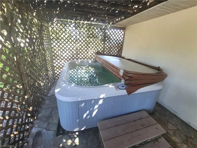View of patio featuring a hot tub