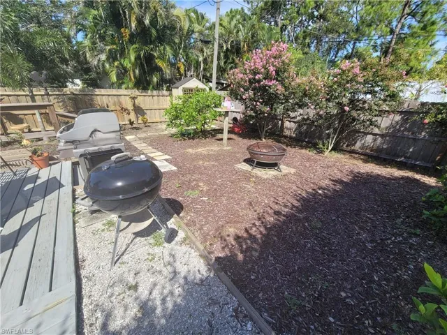 View of yard with a fire pit