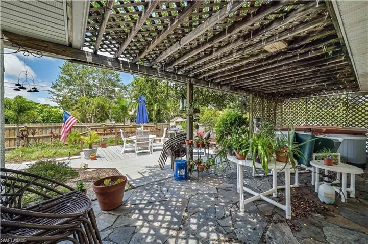 View of patio featuring a pergola and a hot tub