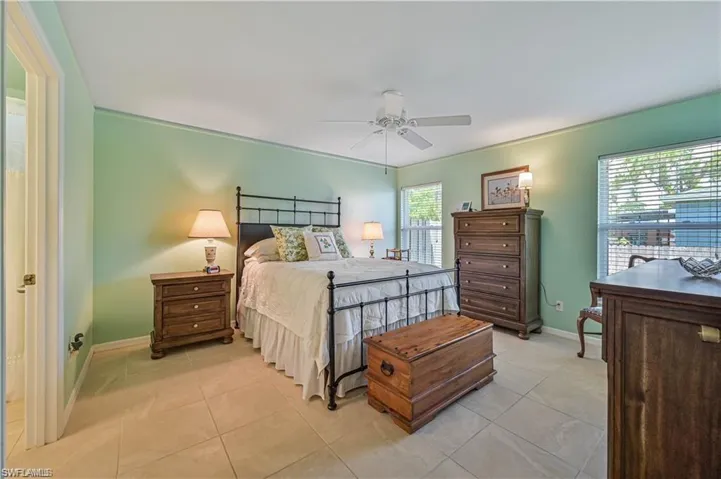 Tiled bedroom with ceiling fan