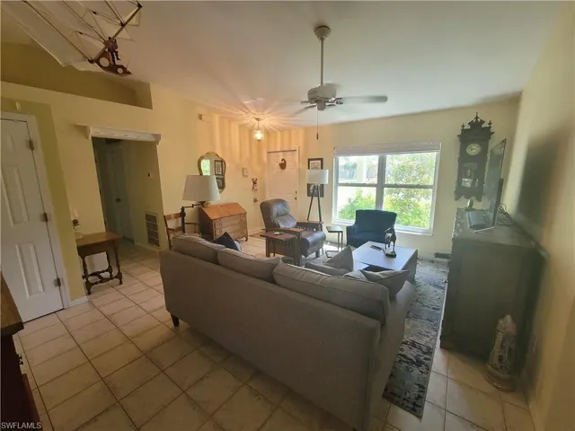 Tiled living room with ceiling fan