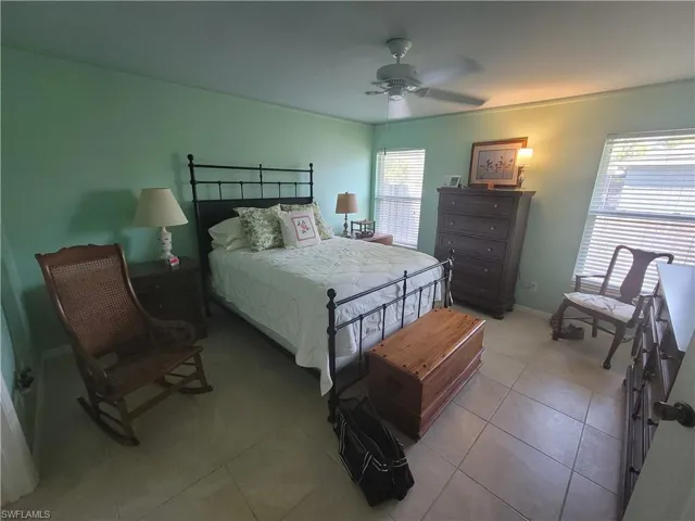 Bedroom featuring ceiling fan and light tile patterned floors