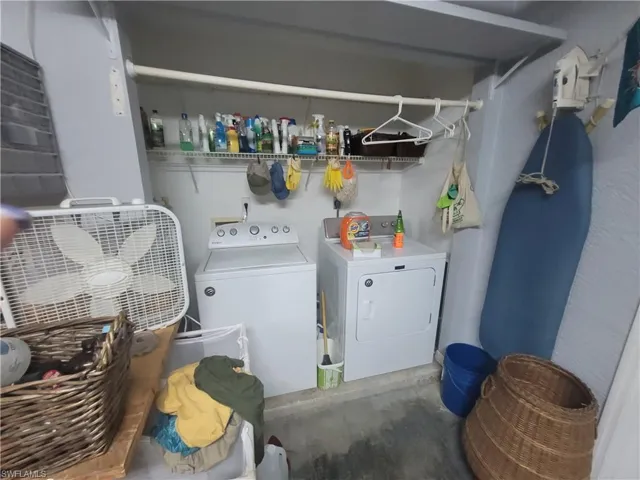 Clothes washing area featuring independent washer and dryer