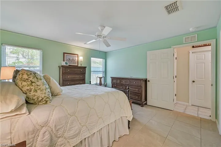 Bedroom featuring ceiling fan and light tile patterned floors