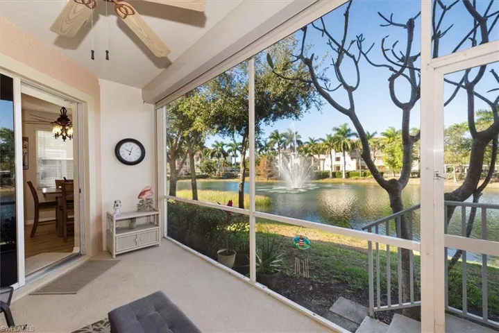 Unfurnished sunroom featuring a water view and carpet flooring