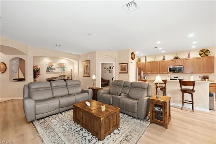 Living room with light wood-style flooring