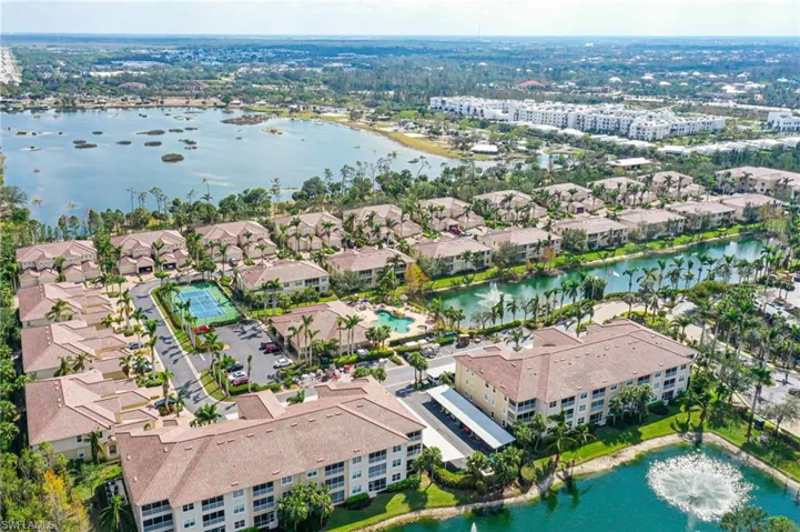 Aerial overview of property's location featuring a nearby body of water and apartment complex / building