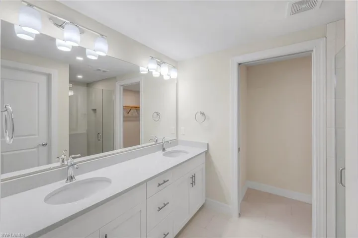 Primary Bath Flipped floor plan from one side of coach home building to the other