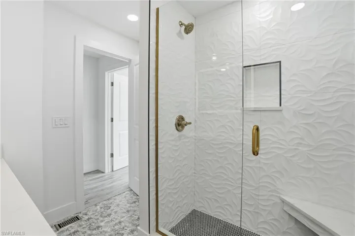 Full bath featuring tiled shower and recessed lighting - Virtually Edited Image