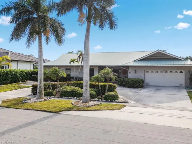 Ranch-style home featuring a garage