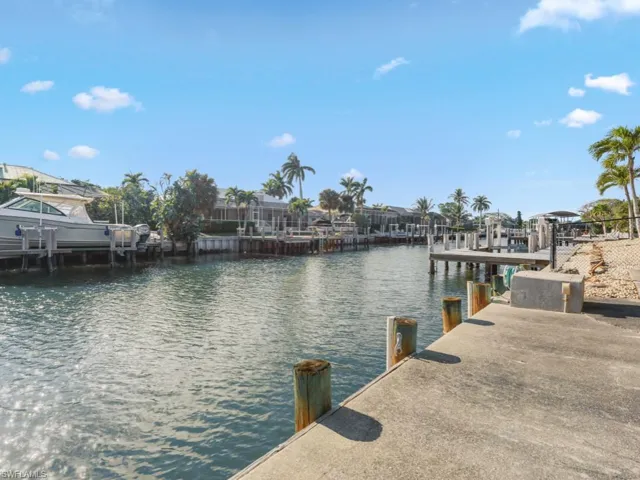 Dock area featuring a water view