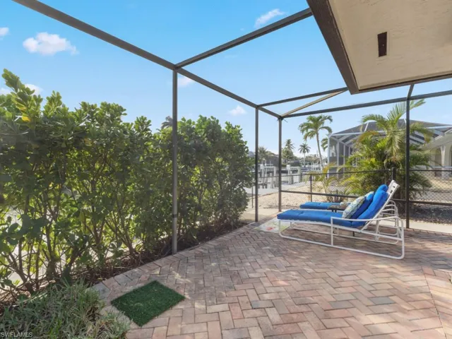 View of patio with glass enclosure