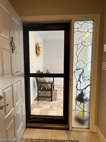 Front Entry with All Season Door- Art Panel Transom Window