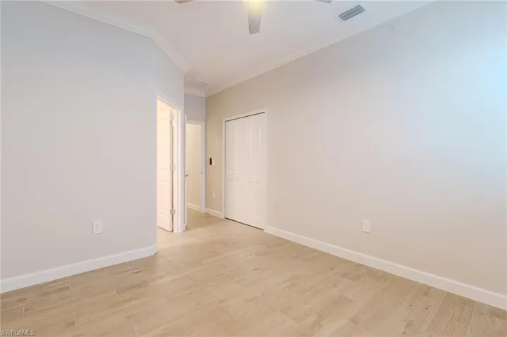 Full bath with vanity and combined bath / shower with glass door