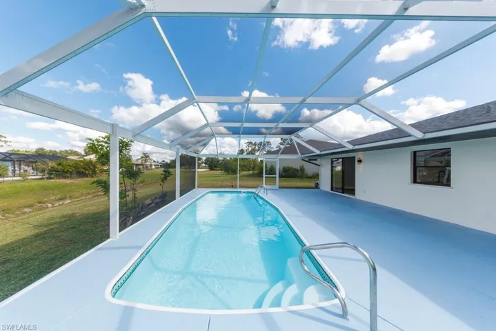 Enjoy year-round outdoor living in the screened pool area with a new enclosure.
